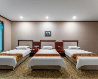 Dong Xiang International Hotel - E’zhou - Habitación