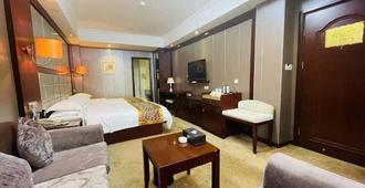 Anqing International Hotel - Anqing - Schlafzimmer