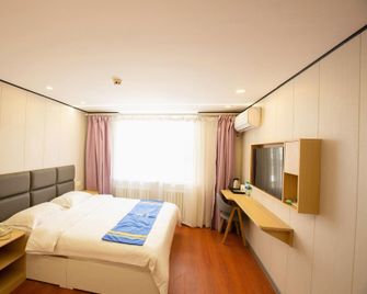 Super 8 Hotel (Jinzhou Renmin Street Xinmate Store) - Jinzhou - Camera da letto