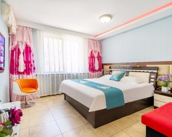 Yilin Xianghe Hotel - 大連 - 寝室