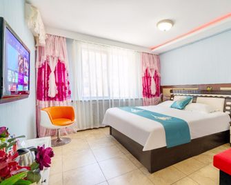 Yilin Xianghe Hotel (Dalian Railway Station Branch) - דאליין - חדר שינה