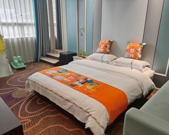 Tiancheng Holiday Hotel (Nanchong Renmin Garden) - Nanchong - Schlafzimmer