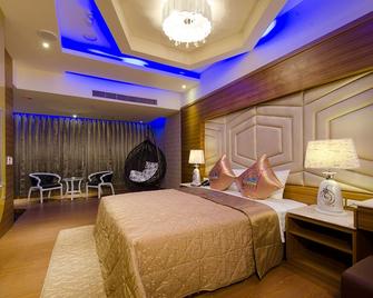 Zhengyi Hotel & Motel - Taitung - Schlafzimmer