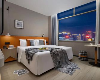 Maizi Hotel (Yunfu Yihua International Plaza Bus Terminal Pedestrian Street Branch) - Yunfu - Bedroom