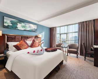 Changsha Weiju Jinye Shennong Grand Hotel (Wu Yi Square Railway Station) - Changsha - Bedroom