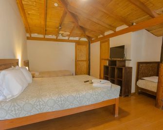 Hospedaje La Quebrada - מנקורה - חדר שינה