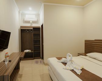 Palapa Hotel - Senggigi - חדר שינה