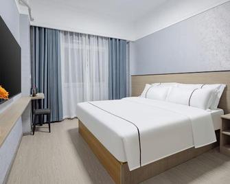 Shiyan Yangchun March Hotel (People's Hospital) - Shiyan - Schlafzimmer