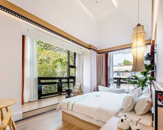 Xishu Garden Inn - צ'נגדו - חדר שינה