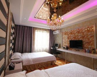 Mango Theme Hotel (Mudanjiang No. 4 Middle School) - Mudanjiang - Habitación