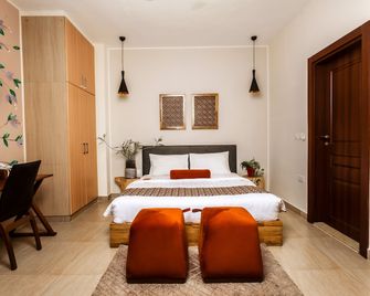 Roots Hotel Apartment - אקרה - חדר שינה