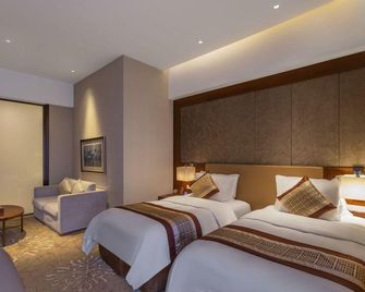 Tgm Hotel - هاربين - غرفة نوم