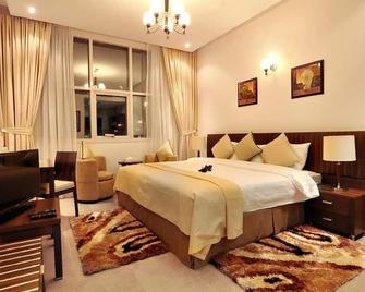 Pride Hotel Apartments - Dubai - Schlafzimmer