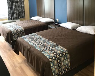 Deluxe Inn & Suites - Baytown - בייטאון - חדר שינה