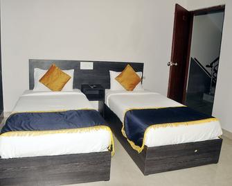 Orange Comforts - Bagaluru - Bedroom