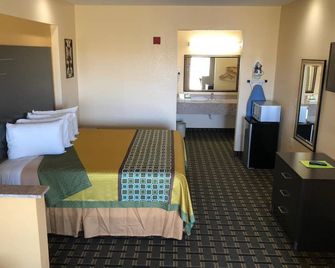 Homegate Inn & Suites West Memphis - West Memphis - Schlafzimmer