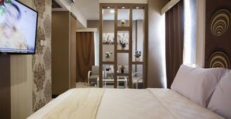 Jle's Hotel - Manado - Bedroom