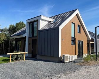 5-person villa with 3 bedrooms and 2 bathrooms - De Cocksdorp - Gebäude