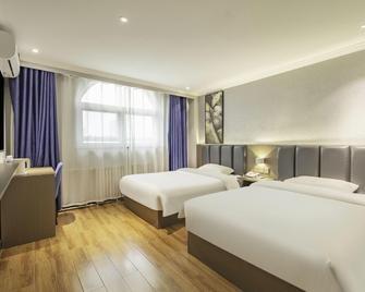 7 Days Inn Liaocheng Xiang Jiang Motor Station Branch - Liaocheng - Schlafzimmer