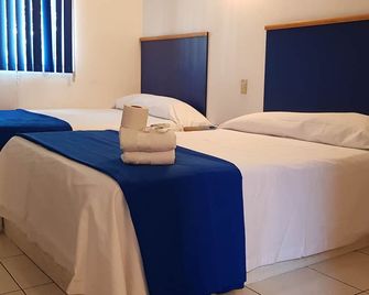 Vagabundo Expo Guadalajara - Guadalajara - Slaapkamer