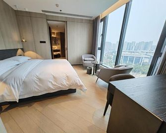 Nanyang Jin She Hotel (Nanyang City Government Wanyuecheng) - Nanyang - Bedroom