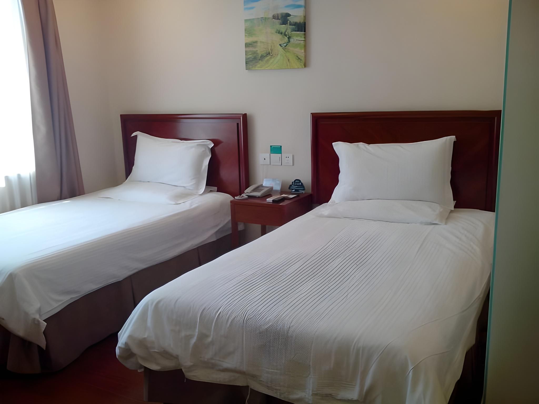 Green Tree Inn Tianjin Dongli Development Zone Metro Station Binhai Airport - تيانجين - غرفة نوم