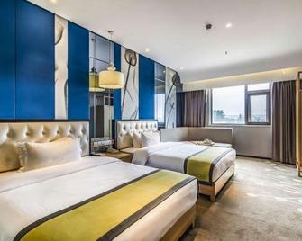 Zhongzhou Elegant Hotel (Luoyang Airport Branch) - Luoyang - Schlafzimmer