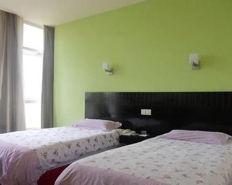 Motel 168 Huoshan - Shanghai - Bedroom