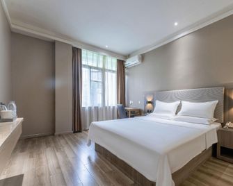 Hanting Hotel Ningde Red Star Macalline - Ningde - Schlafzimmer
