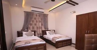 Zifan Hotel & Suites - Karachi - Bedroom