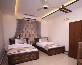Zifan Hotel & Suites - Karáčí - Ložnice