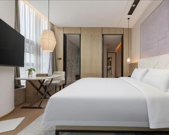 C-Young Wetland Park Hotel - Xiangyang - Bedroom