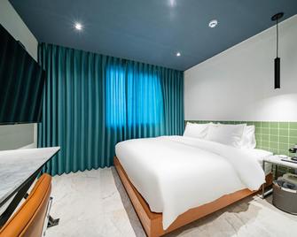Gangneung Gyeongpodae Hotel The One - Gangneung - Bedroom