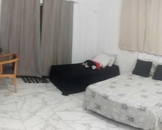 SR Casa de férias Astúrias - Guarujá - Sala de estar