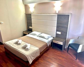 Kornilios Palace - Anchialos - Schlafzimmer