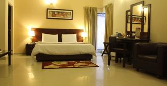 Hotel One Bahawalpur - Bahāwalpur - Bedroom
