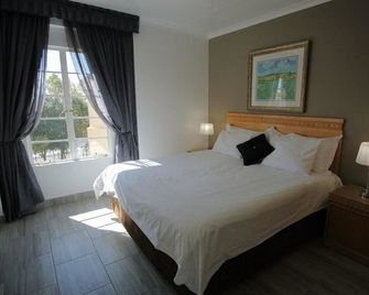 Airport Inn Executive Suites - Йоганнесбург - Спальня