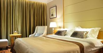 San Jiang Grand Hotel - Vientiane - Bedroom