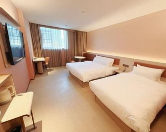 Hanting Hotel Yangzhou Wutinglong Toy Market - Yangzhou - Schlafzimmer