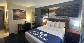Days Inn & Suites by Wyndham Gunnison - Gunnison - Bedroom