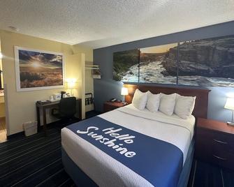 Days Inn & Suites by Wyndham Gunnison - Gunnison - Bedroom