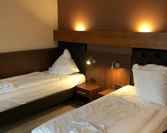 Hotel & Restaurant Poseidon - Bayreuth - Camera da letto