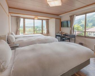 Central Inn Hakuba - האקובה - חדר שינה