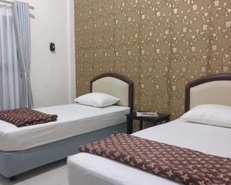 Wisma Liontine - Palangkaraya - Bedroom