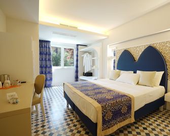 Suite Hotel L'Oasi di Riaci - Ricadi - Slaapkamer