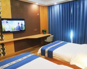 Asia Hotel - Zibo - Schlafzimmer