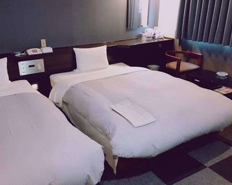 Business Hotel Oriental Izuro - Kagoshima - Bedroom