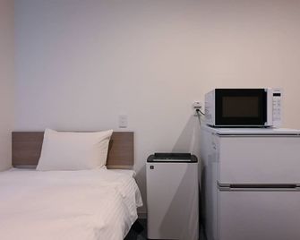 Hotel R9 The Yard Ota - Ота - Спальня