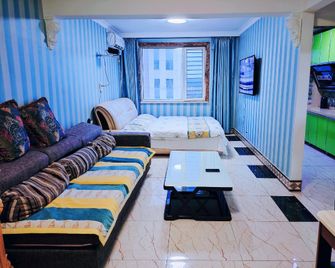 Coco Apartment (Zhongwei International Branch) - Фушунь - Спальня