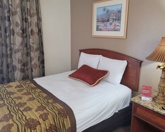 Queens Lodge Motel - ווסט פאלם ביץ' - חדר שינה